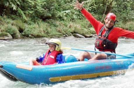 Serendipity guide with young child on whitewater trip