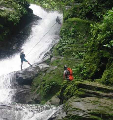 Costa Rica adventure travel: you can rappel next to tropical waterfalls into the pool at the bottom.