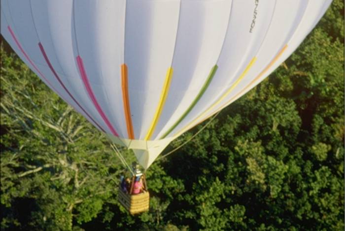 Flying Serendipity's balloon over rainforest in Costa Rica
